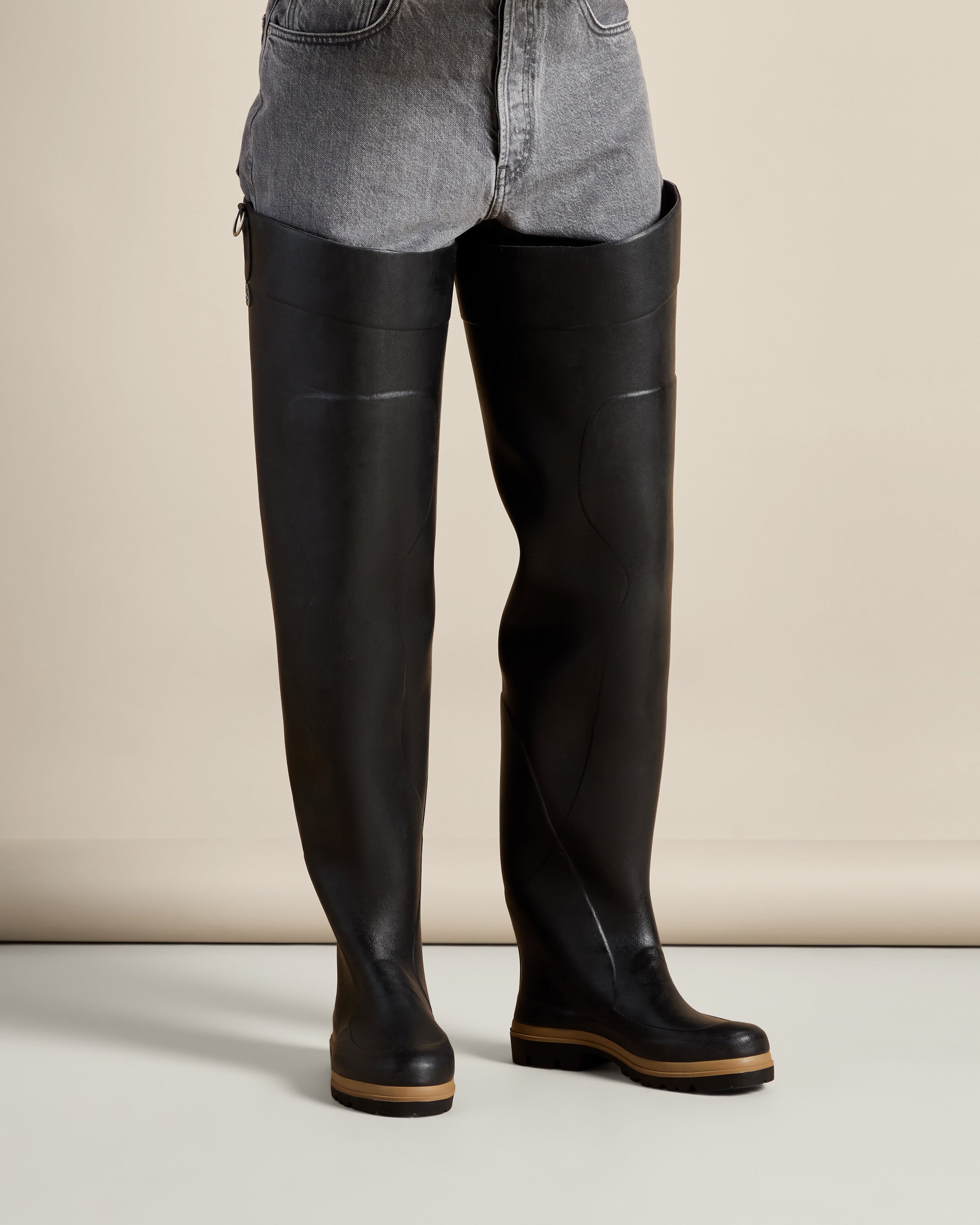 Detailed close-up of the Men's Océane Ponti Lined Thigh Boot in Black’s outsole, emphasizing the deep, aggressive tread pattern for enhanced grip and traction.