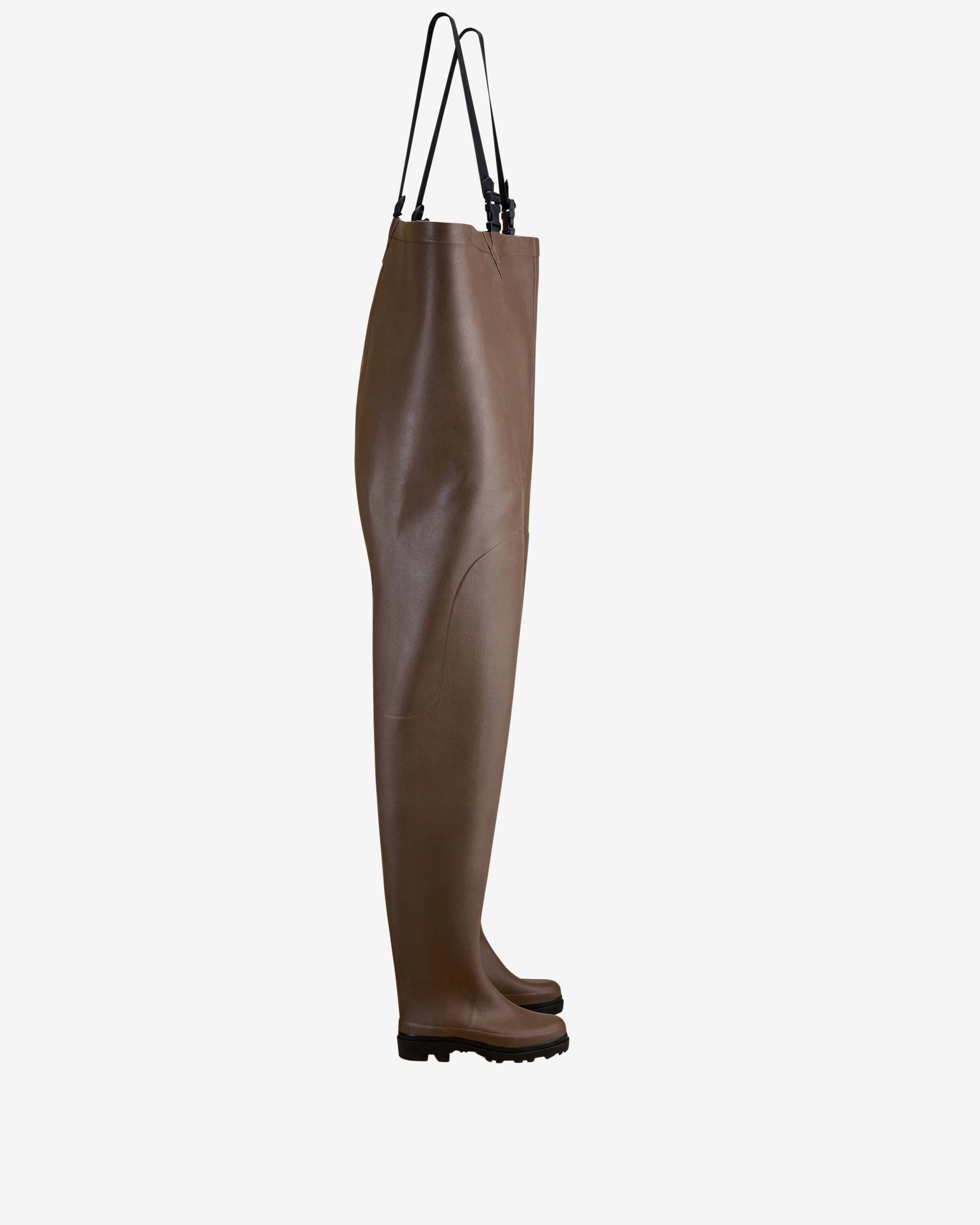 A side profile of the Mer Renforcé Waders in Brown, shown isolated on a white background. The waders are fully extended with black adjustable shoulder straps hanging from the top.