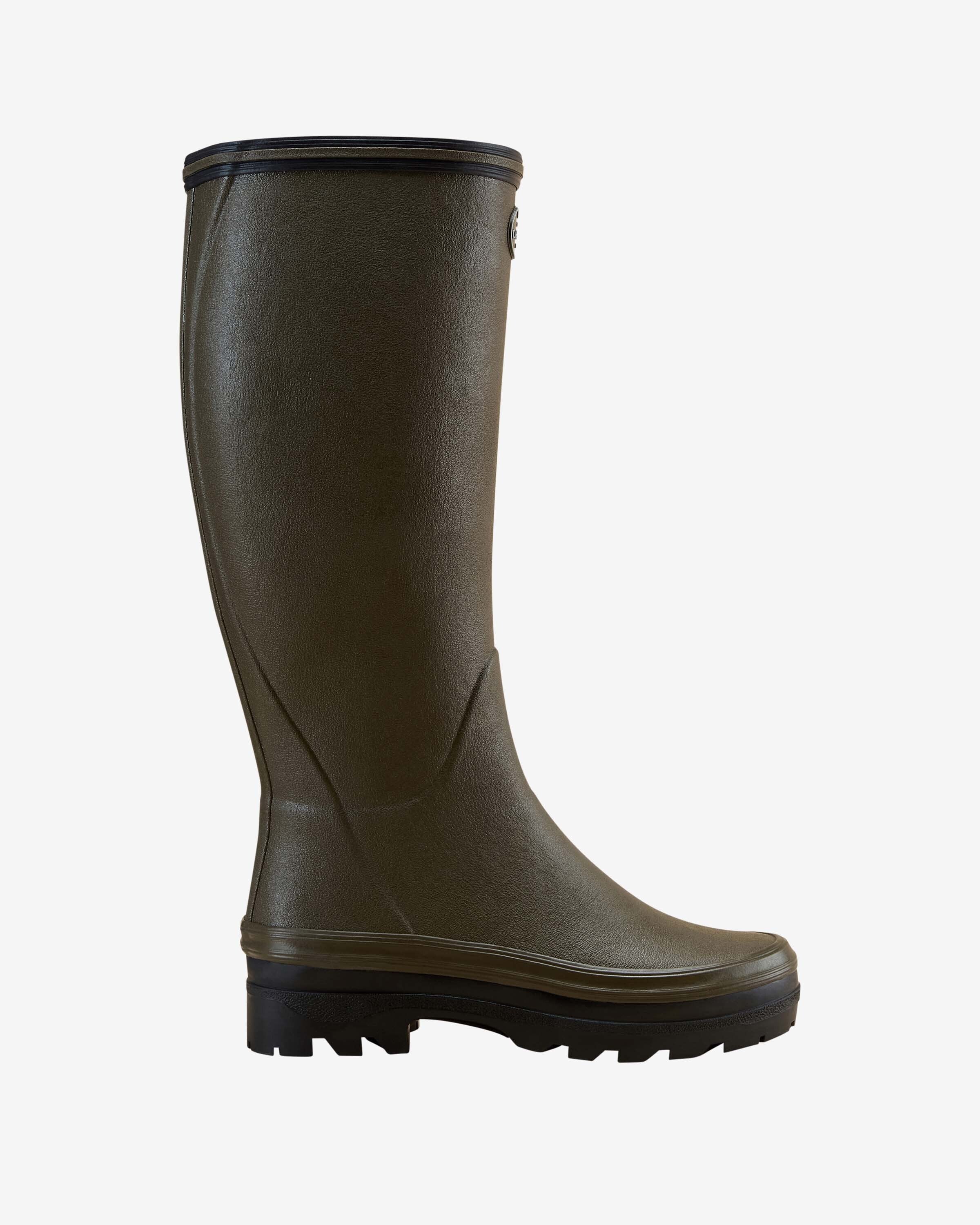 Side profile view of a single Women's Giverny Jersey Lined Wellington Boot in Chameau Green, showcasing its sleek, streamlined silhouette with black trim and sole, on a plain white background.