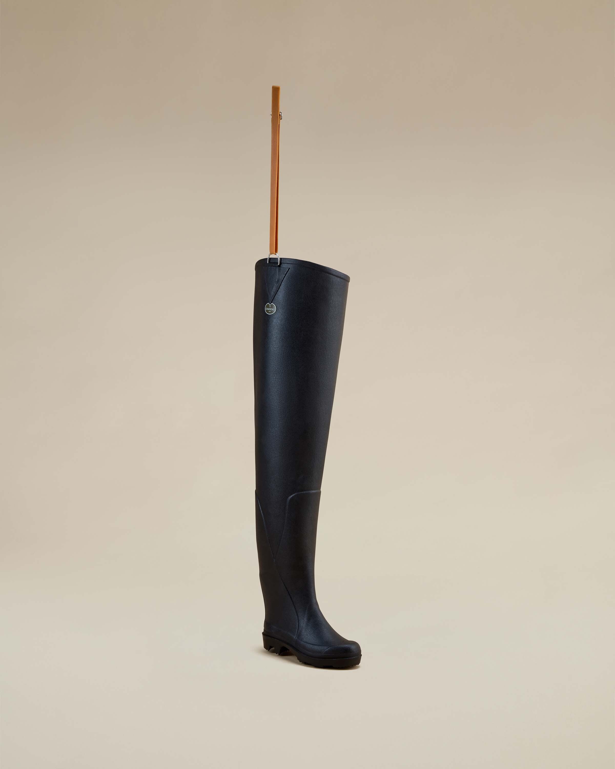 A single Women's Océane Ponti Lined Thigh Boot in Black angled in a three-quarter front view, highlighting the smooth rubber exterior, molded footbed, and the detailed stitching along the sides.