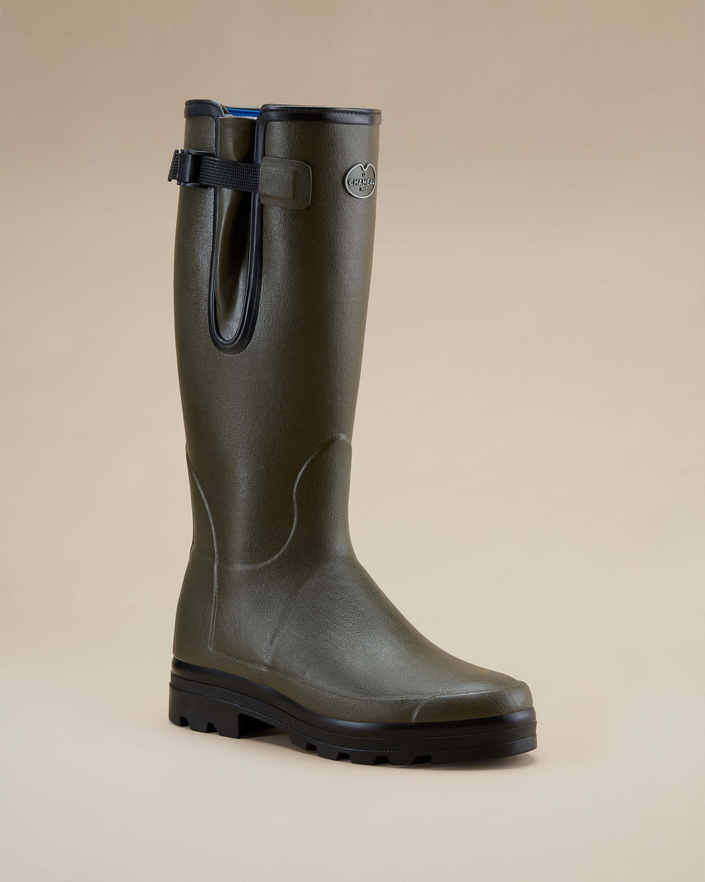Angled side view of a single Men's Vierzonord Neoprene Lined Wellington Boot in Chameau Green photographed against a neutral background. The boot is positioned to showcase its slightly rounded toe, ribbed ankle structure, and thick tread.