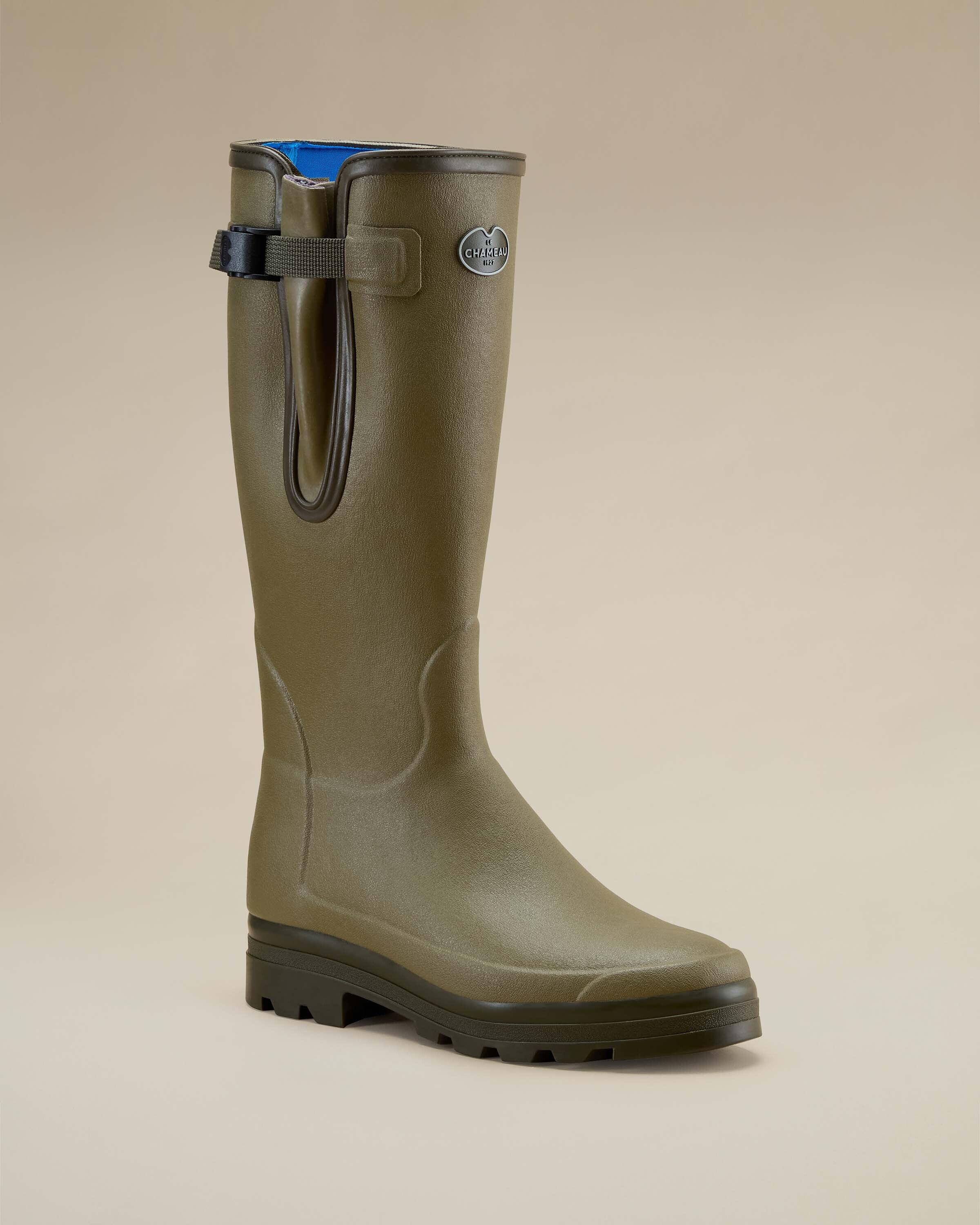 Single Men's Vierzonord Neoprene Lined Wellington Boot in Iconic Green displayed at a 3/4 front angle on a neutral background. The image showcases the contoured rubber texture, ankle shaping, and adjustable side strap near the boot’s opening.