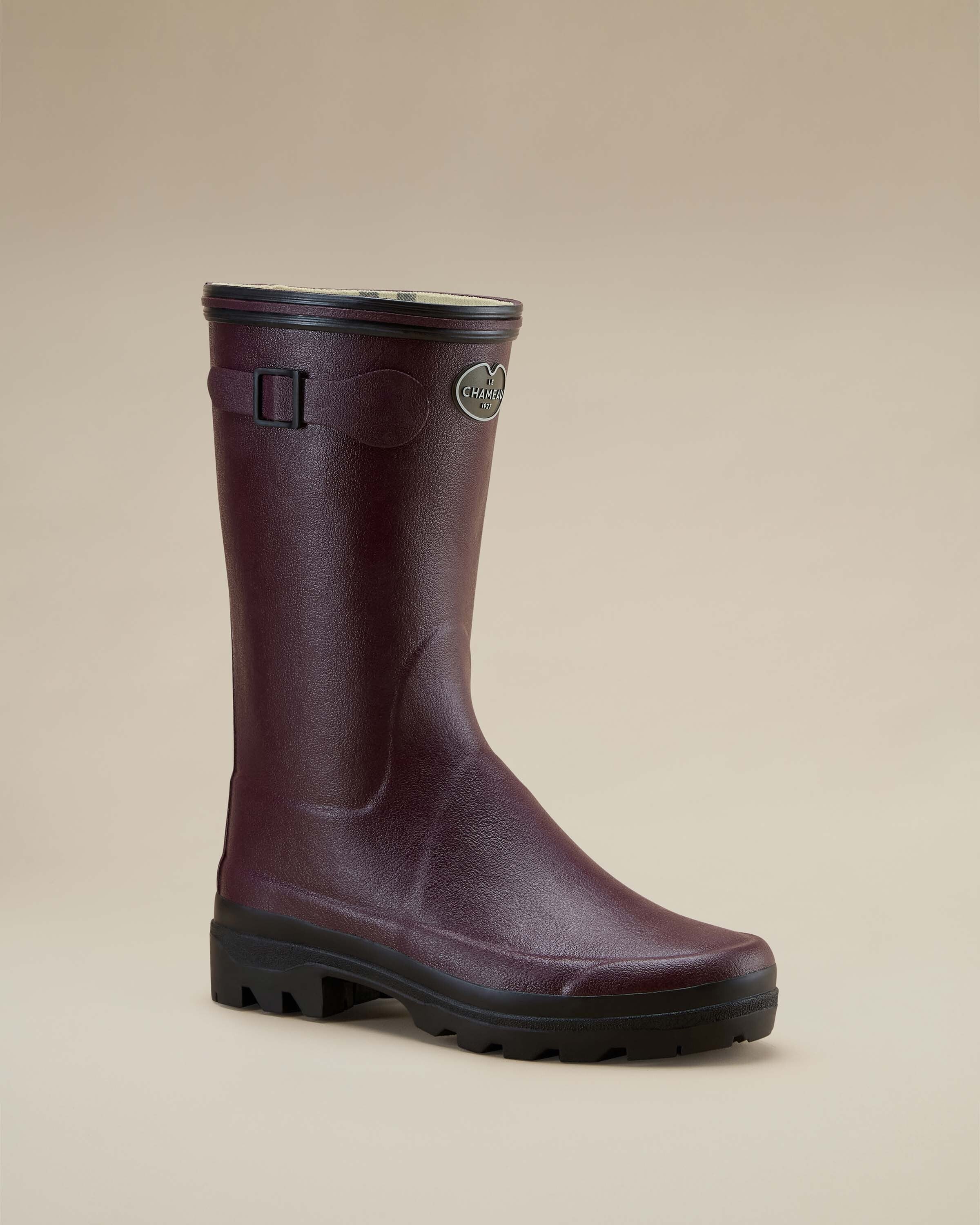 Single Women's Giverny Jersey Lined Bottillon in Cherry Red angled to show front and outer side view. The image, on a beige background, emphasises the contoured rubber design, black tread sole, and side branding.